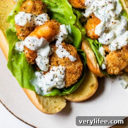 Crispy Air Fryer Shrimp Sandwich with Zesty Tartar Sauce 6 Crispy air fryer shrimp served on a soft potato bun with lettuce and homemade tartar sauce is the perfect summer sandwich.