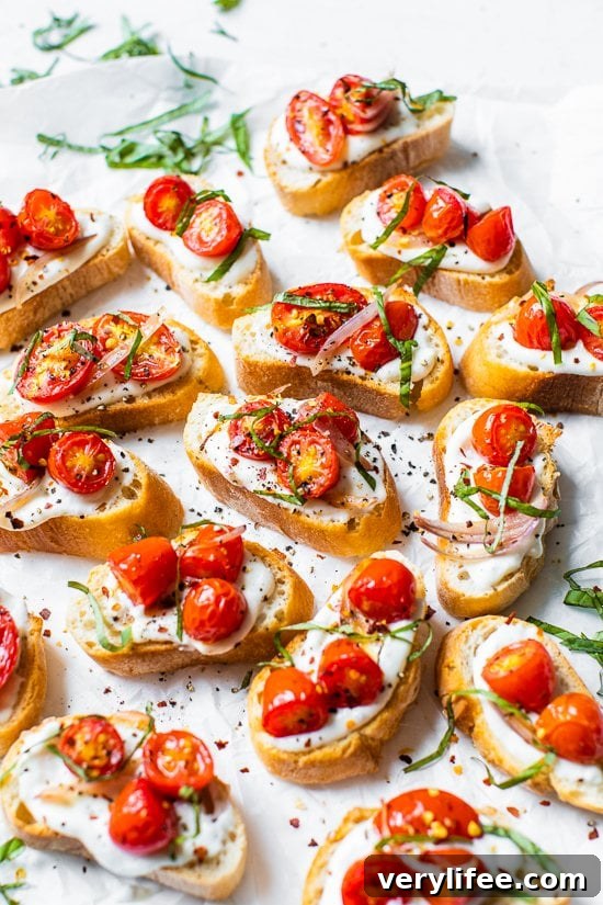 Creamy Whipped Ricotta Toast with Roasted Tomatoes 9 Whipped Ricotta Toast with Roasted Tomatoes on a white background