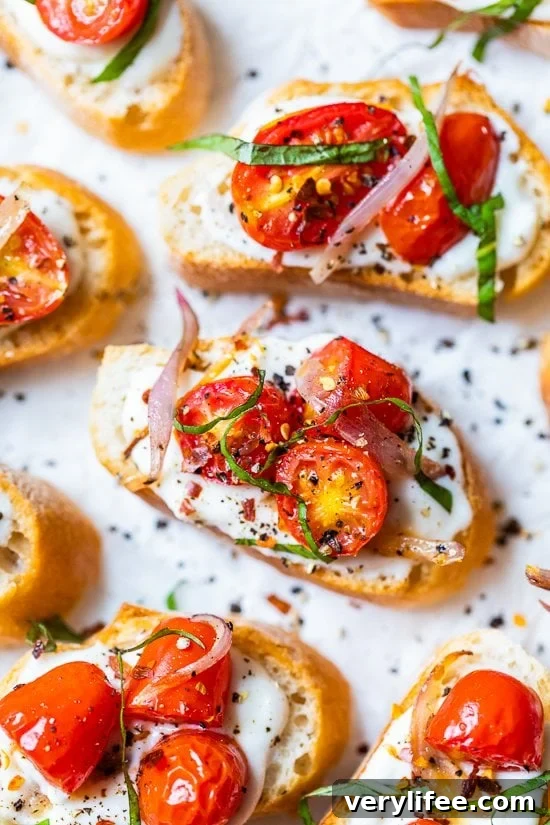 Creamy Whipped Ricotta Toast with Roasted Tomatoes 10 Whipped Ricotta Toast with Roasted Tomatoes on a white background