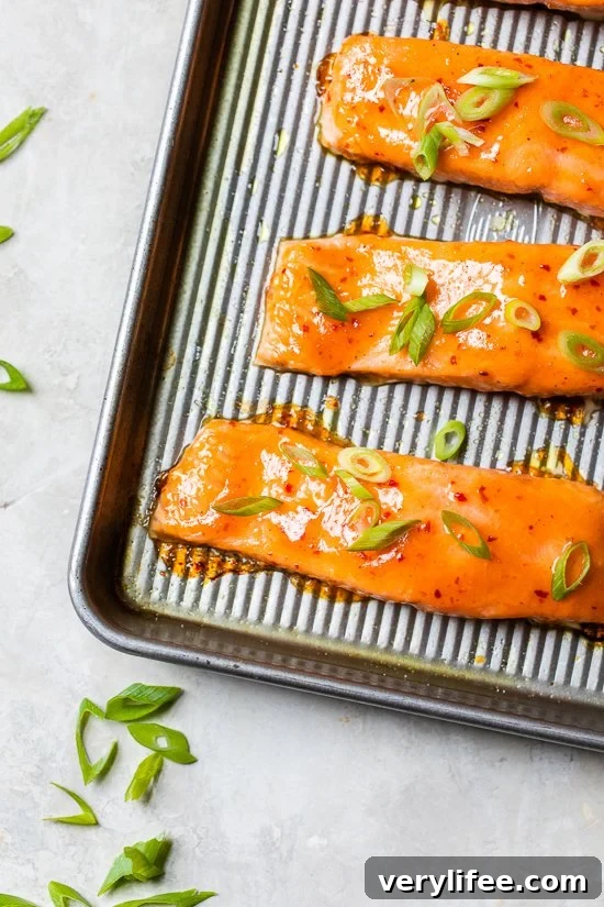Honey-Chili Glazed Salmon Recipe: Sweet and Spicy 5 cooked salmon on a sheet pan