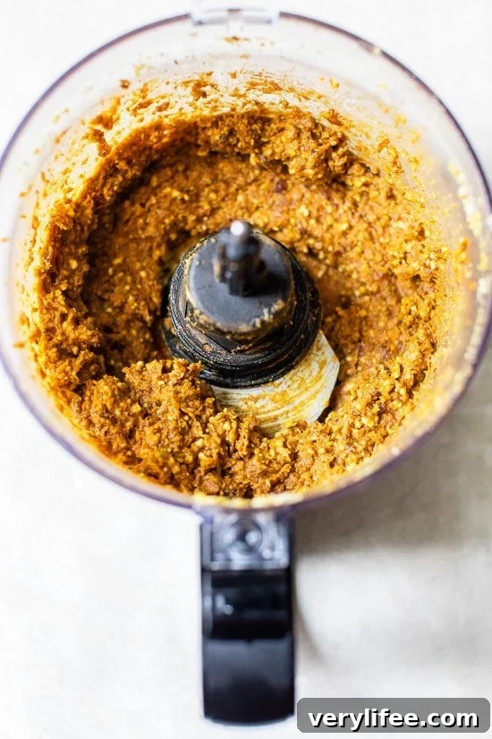 Made with cashews, pistachios, dates, pumpkin and spices, these no-bake Pumpkin Pistachio Energy Balls taste like little bites of pumpkin pie. Pumpkin pistachio energy ball ingredients in a food processor