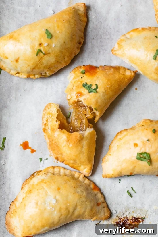 Chilean Mini Empanadas with Caramelized Onions 8 Chilean empanadas with hot sauce