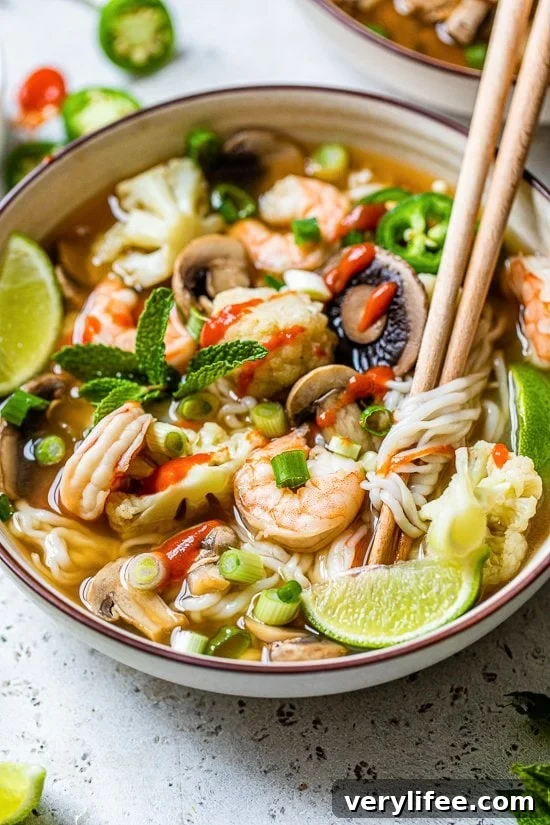 30-Minute Shrimp Pho with Fresh Vegetables 4 Shrimp noodle soup with chopsticks