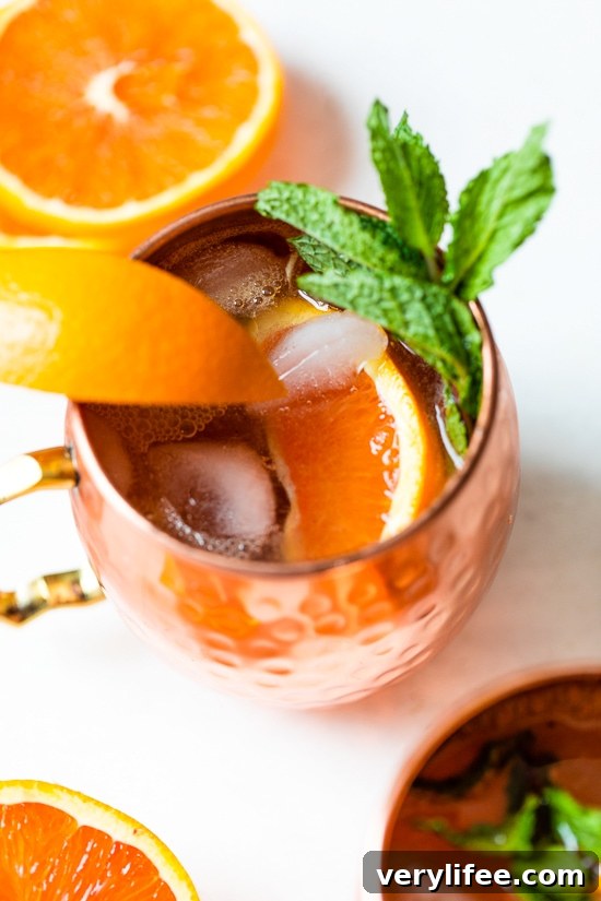 orange moscow mule in copper mugs
