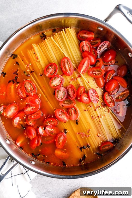 One-Pot Spaghetti Puttanesca with Olives and Capers 3 pasta tomatoes and water in a skillet before cooking