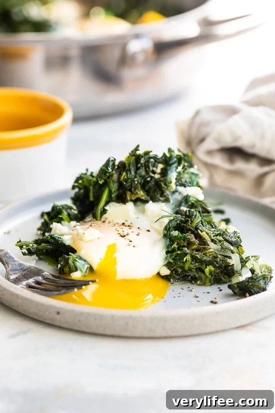 Egg with runny yolk and spinach.