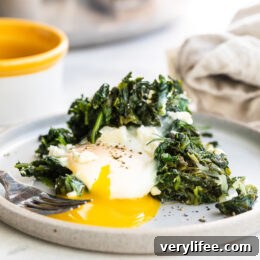 Egg with runny yolk and spinach.