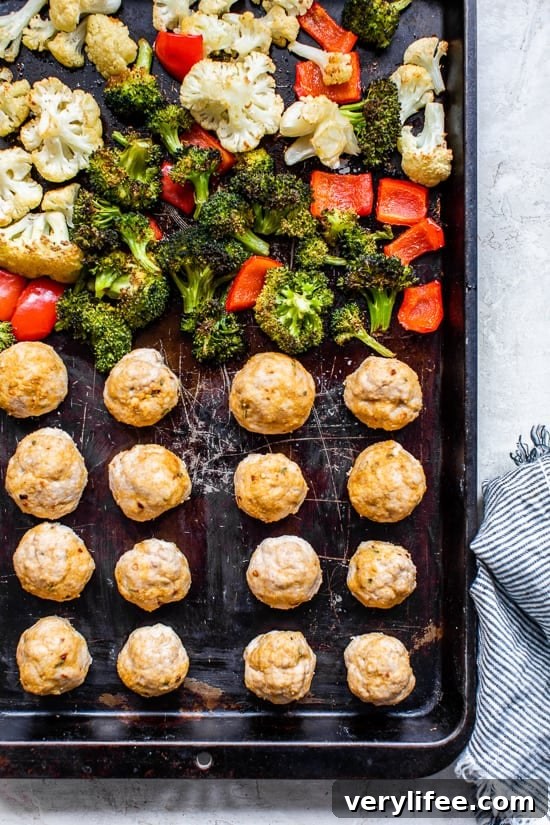 Enjoy this Italian Turkey Meatball Sheet Pan Dinner with the most tender turkey meatballs made from scratch and seasoned vegetables for an easy meal.