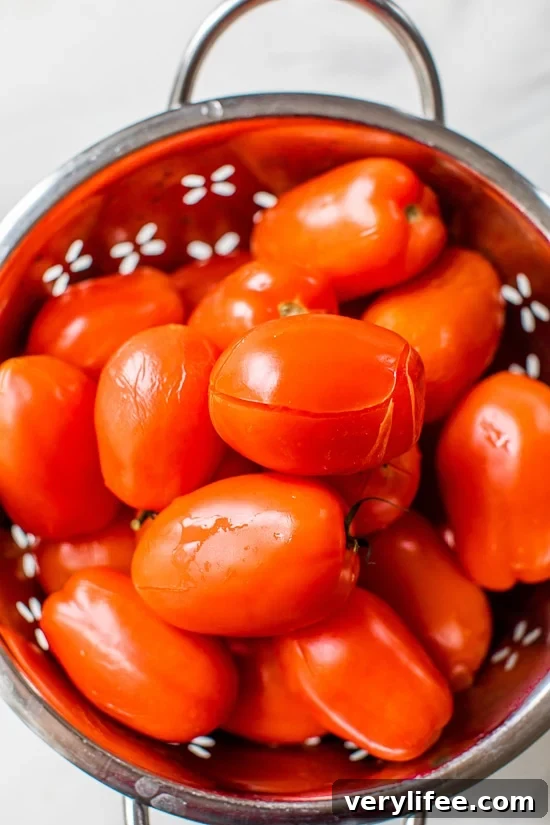 Blanch the tomatoes to remove the skin