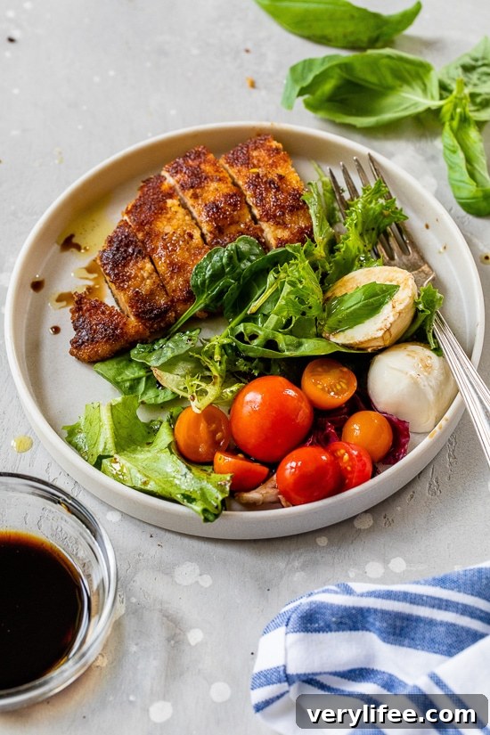 Caprese Chicken Cutlet Salad with Mozzarella and Basil 4 Chicken cutlets with caprese salad.