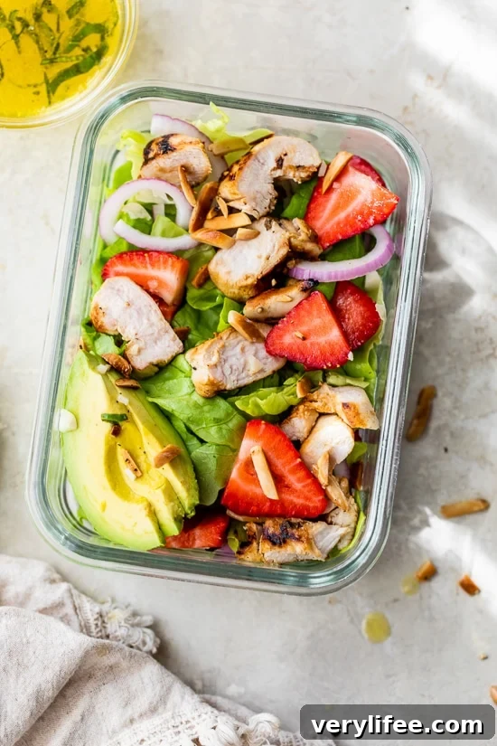 Grilled chicken salad in a meal prep container.