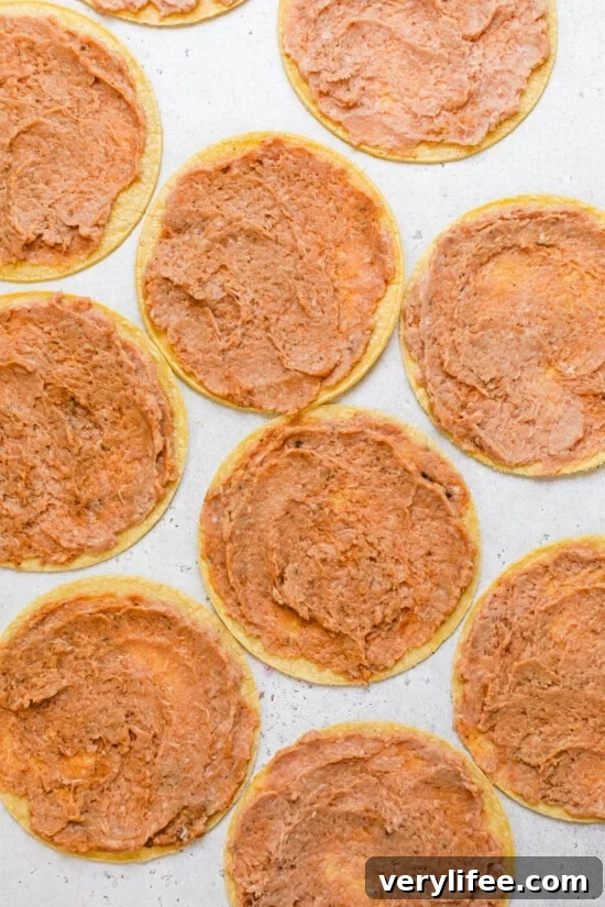 Spread the meat onto the corn tortillas
