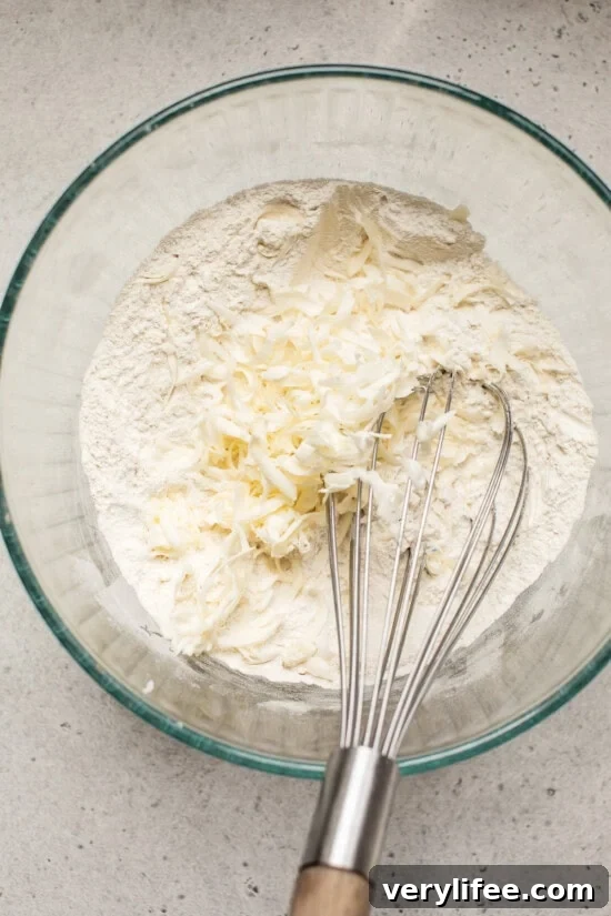 Mix dry ingredients and fold in cold butter