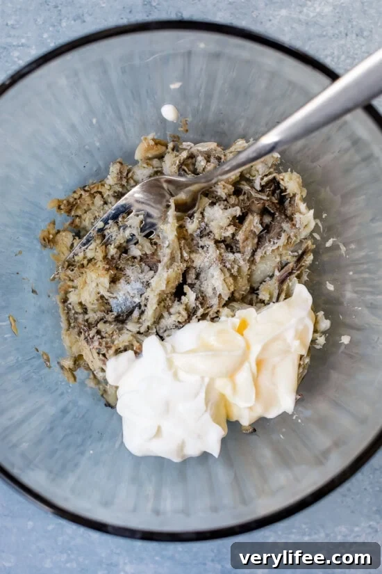 Sardine Salad Recipe with Lemon, Capers and Olive Oil 6 Sardines and mayo in a bowl