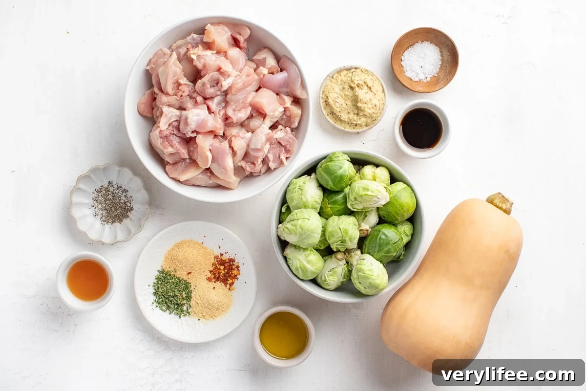 Maple Dijon Sheet Pan Chicken with butternut squash and brussels sprouts.