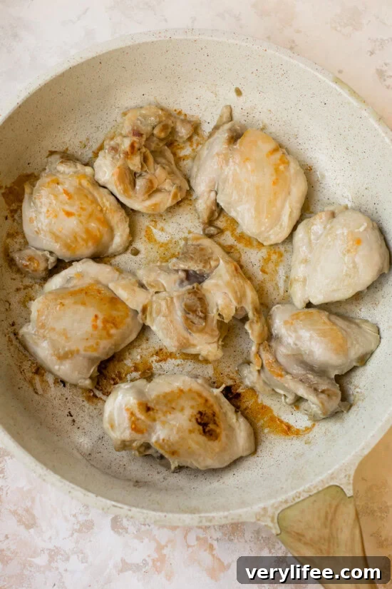 Slow Cooker Chicken with Apples and Cinnamon 7 brown chicken thighs in skillet