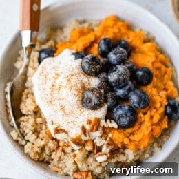 Healthy breakfast bowl with sweet potatoes, blueberries, and quinoa.